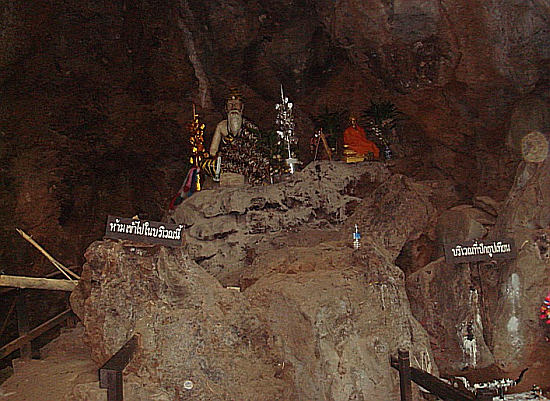 statues at the cave entrance